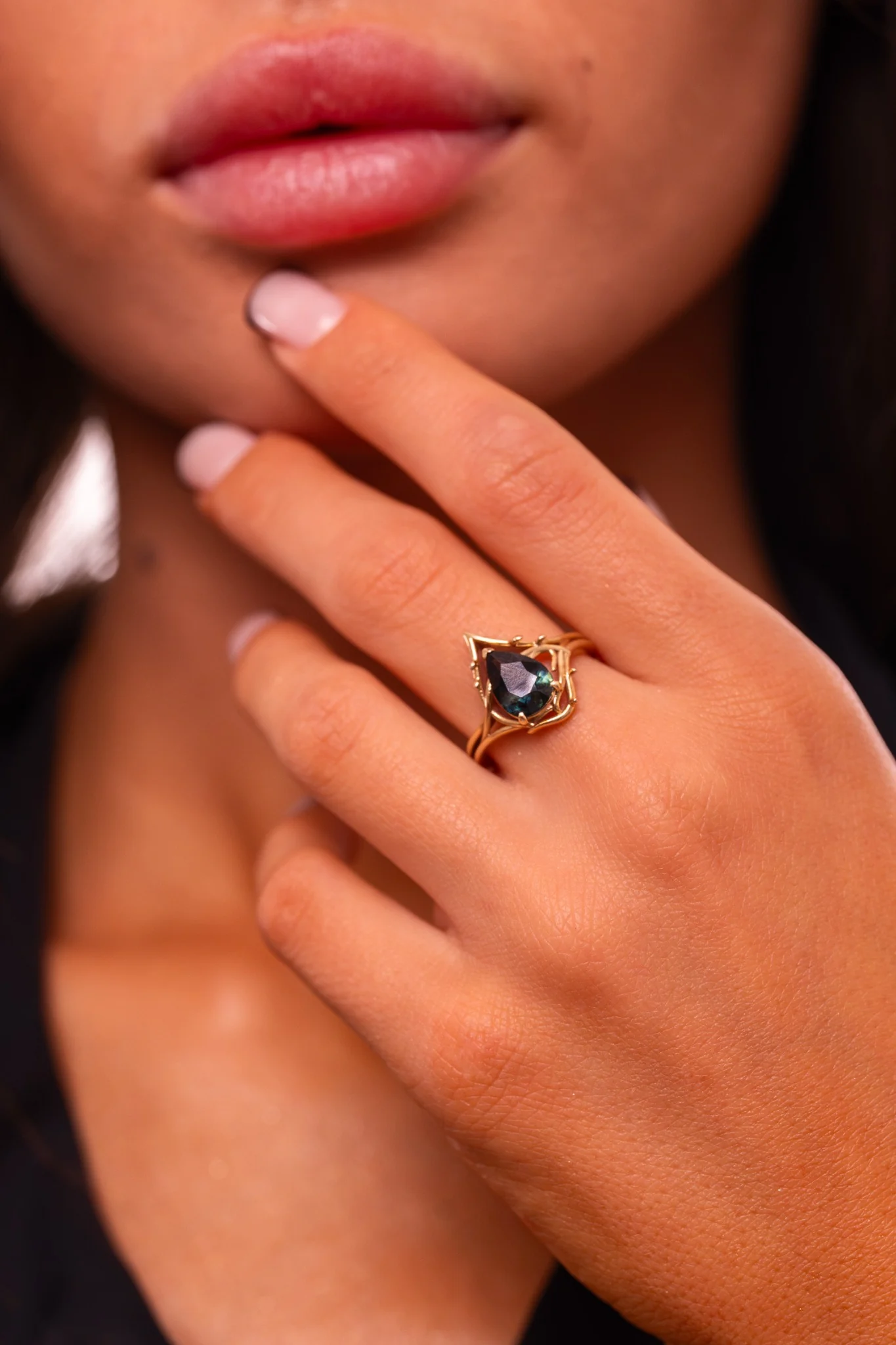 Mystique Dark Rose, the finished one-of-one gold ring worn on a hand
